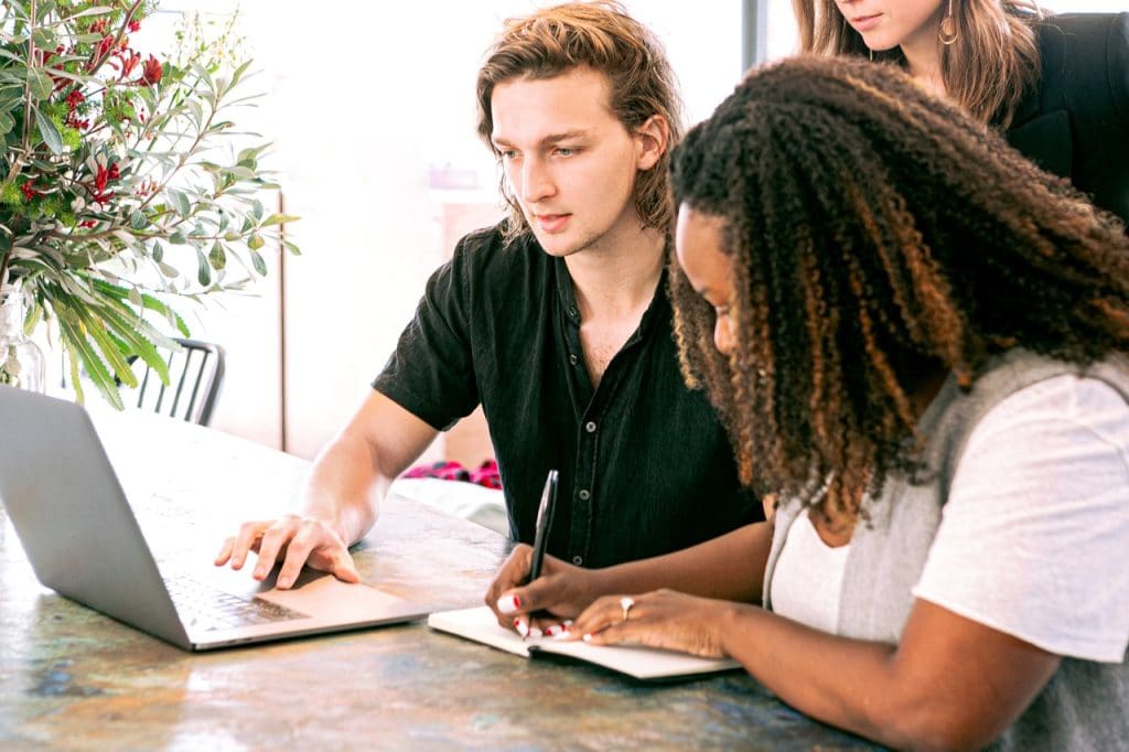 Girl with curly hair making notes