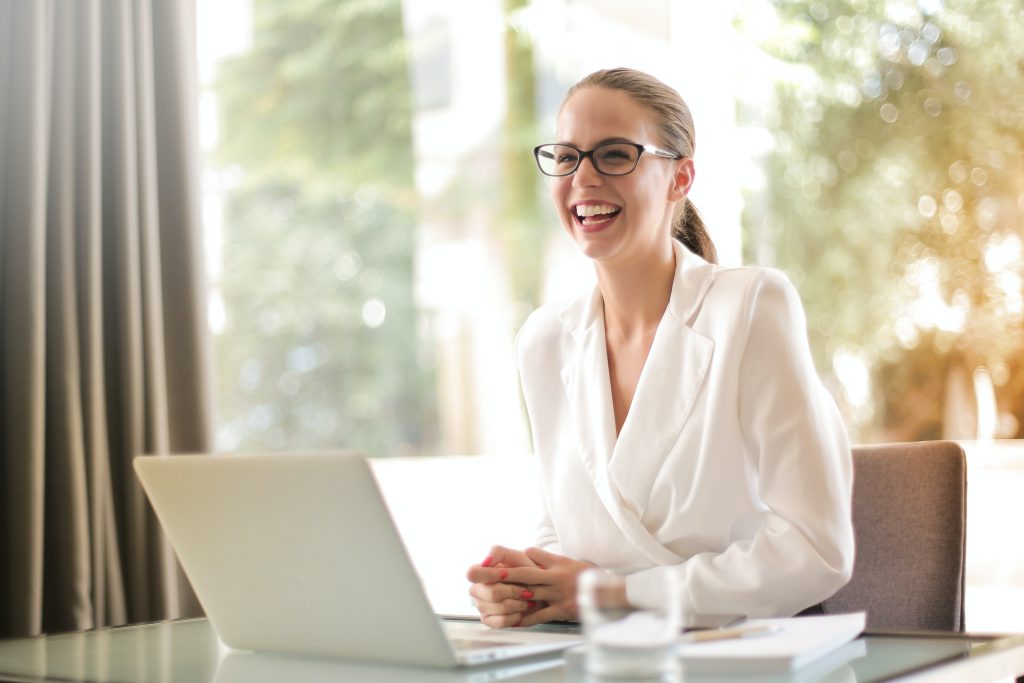 happy person working on laptop