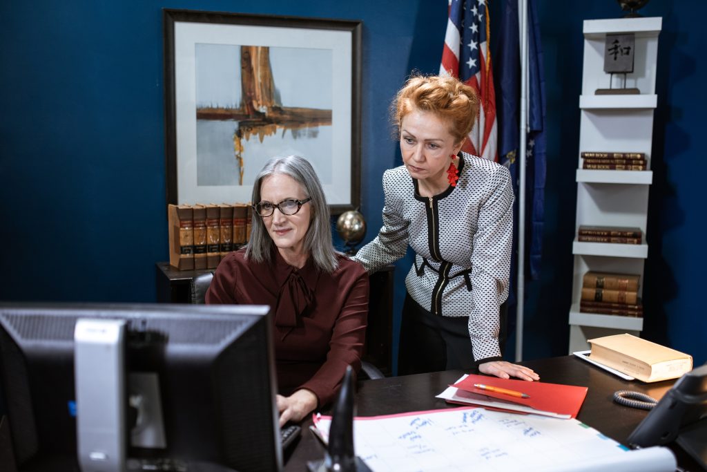 two women working together