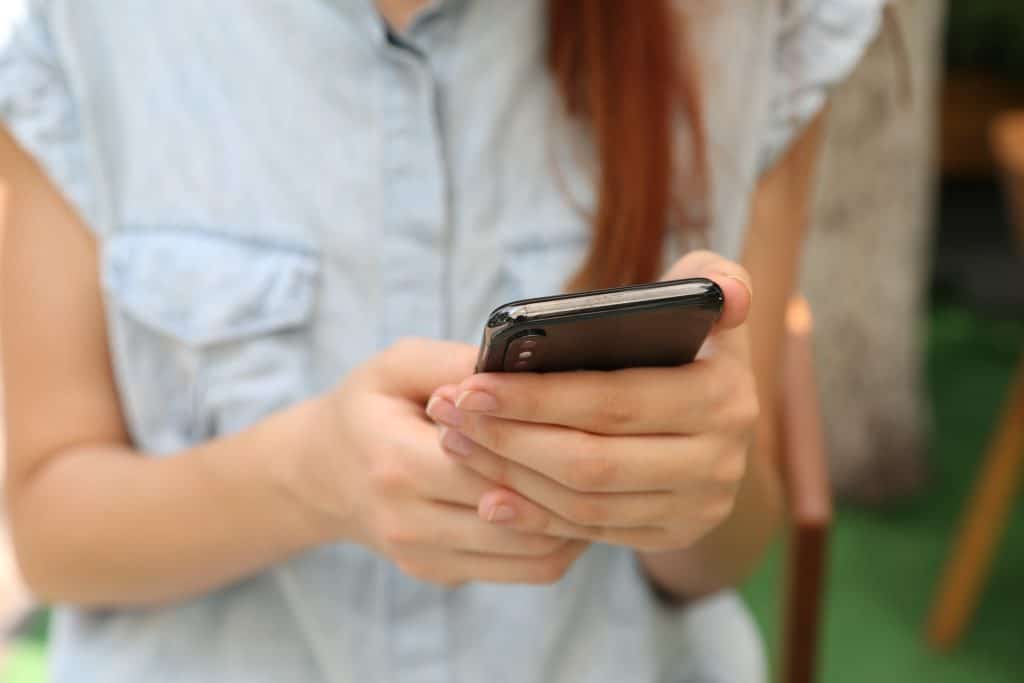 girl holding phone